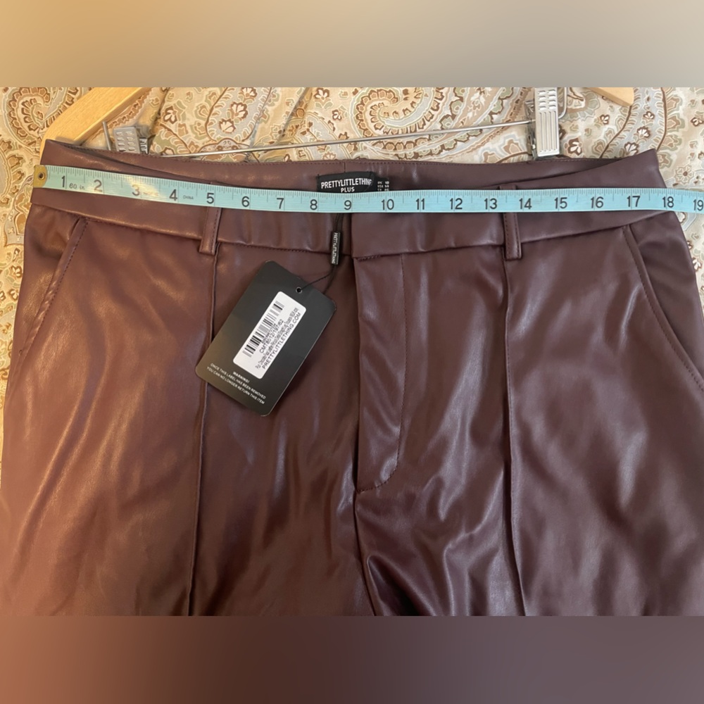 PrettyLittleThing high rise, pintuck detail faux leather straight leg trousers.